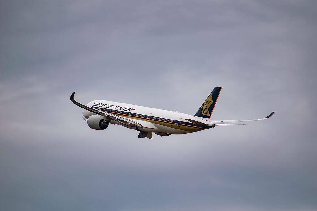 Aeroplane flying high in the sky with cloudy background: flight traveling to russia