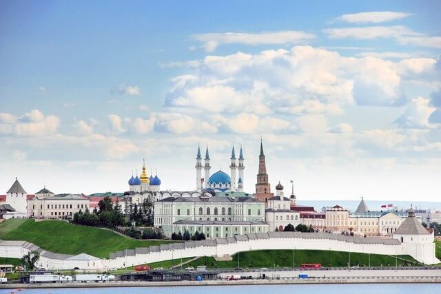 Kazan, Republic of Tatarstan, Russia. View of the Kazan Kremlin with: Presidential Palace, Soyembika Tower, Annunciation Cathedral, Qolsharif Mosque from the Kazanka River.