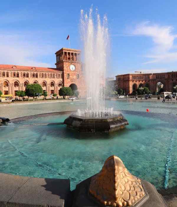 fountain at a square in a city